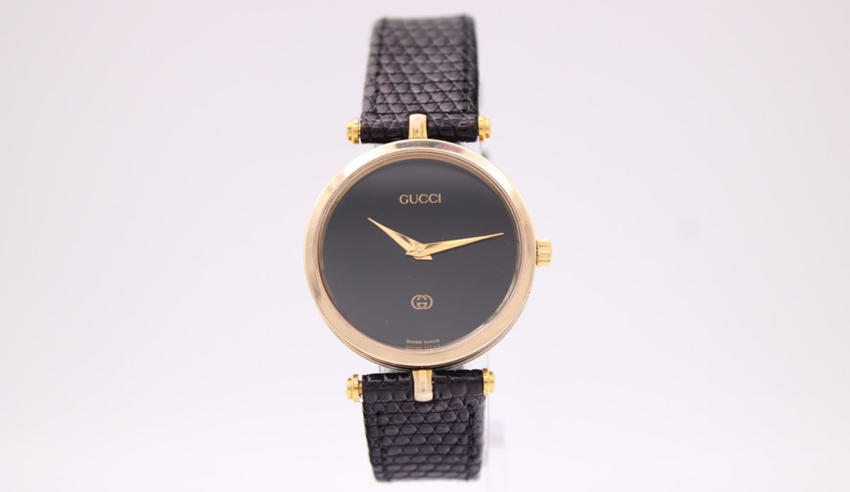 Gucci 2000 M watch with black dial and gold case, 1980s