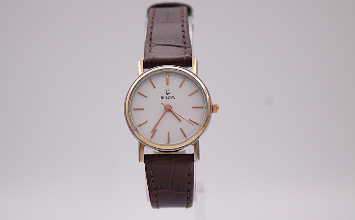 Bulova watch with white dial and two-tone case, 1990s