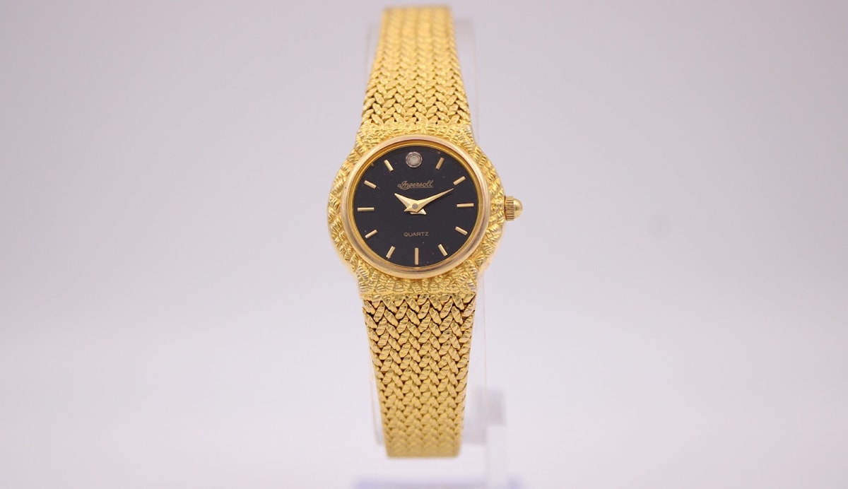 Ingersoll 28786 U watch with black dial and gold case, 1990s