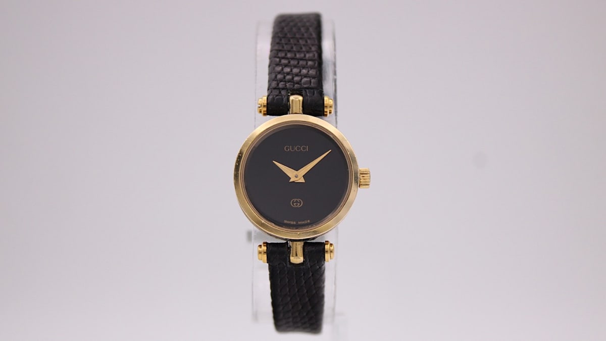 Gucci 2000L watch with black dial and gold case, 1990s