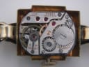 Close-up of the manual wind Omega movement, showing "OMEGA WATCH Co SWISS" and "FIFTEEN 15 JEWELS" and serial number 1140988.