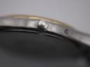 Extreme close-up of the Omega-signed crown.