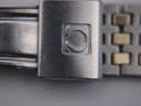 Close-up of the Omega-signed fold-over clasp on the bracelet.