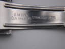 Inside of the bracelet clasp, showing 'OMEGA DL.1375.374 STAINLESS STEEL' engraving.