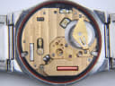 Close-up of the Omega quartz movement inside the watch, showing serial number 4407134 and 'SWISS 1330'.