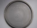 Inside case back engraving, revealing 'LUNETTE PLAQUE OR G 20 MICRONS' and 'FOND ACIER INOXYDABLE'.