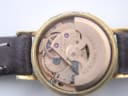 Close-up of the Omega calibre 661 movement, with visible serial number 3233440 and other movement details.