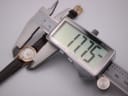 Close-up of a digital caliper measuring the watch case diameter at 17.75mm.