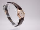 Another angled side view of the EBEL watch, showing its slim profile and lug design.