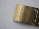 Close-up of the gold-tone folding clasp with 'RADO' engraved.