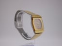 Another side angled view of the Rado Diastar on a stand, showing the two-tone bracelet.
