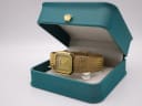 Santima watch displayed open in its original teal box, featuring a gold crown emblem on the lid.