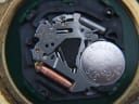 Close-up of the Seiko V732C quartz movement with a Renata 373 battery installed, showing internal components.