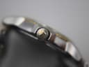Close-up side view of the gold PVD crown, clearly showing the embossed Tissot 'T' logo.