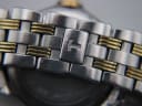 Close-up of the integrated two-tone steel bracelet, with a brushed finish and a hidden butterfly clasp featuring a Tissot 'T' logo.