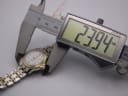 Digital caliper measuring the case diameter of the Tissot Ballade watch, displaying a precise measurement of 23.94mm.