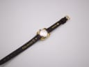 Back view of the watch showing the stainless steel case back and 'CROCO CALF' inscription on the strap.