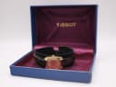 The Tissot Seastar Seven watch presented inside its original blue Tissot box with purple interior.
