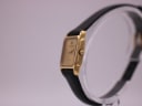 Side profile of the gold Raymond Weil watch, highlighting the crown and case thickness.