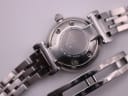 Detailed view of the Emporio Armani AR-1781's solid stainless steel case back with model (AR-1781) and serial (111304) engravings, showing the integrated bracelet and butterfly clasp.