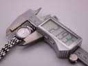 A digital caliper measuring the Emporio Armani AR-1781 watch case diameter at 21.93mm, confirming its petite size.