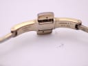 Close-up of the watch's folding clasp interior, showing 'STAINLESS STEEL' and the model reference 'T058009'.