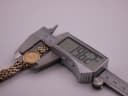 Digital caliper measuring the case diameter of the Tissot watch, displaying a precise measurement of 19.62mm.