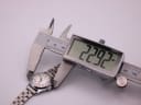 Digital caliper measuring the Jaquet-Droz watch case diameter at 22.92mm.