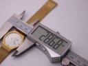 Digital caliper measuring the case diameter of the Toy Watch at 28.68mm.