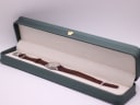The Favre Leuba watch presented inside its original dark green presentation box.
