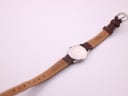 Back view of the Favre Leuba watch, showing the case back and the inner side of the leather strap.