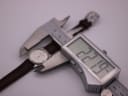Digital caliper measuring the Favre Leuba watch case, displaying 22.19mm.
