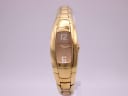 Front view of the Maurice Lacroix IN3012 gold-plated watch, showing its tonneau case and brown dial with '12' and '6' numerals.
