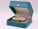 The Maurice Lacroix IN3012 gold-plated watch displayed open in its original turquoise presentation box.