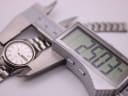 The SEIKO 2906-0020 watch being measured by a digital caliper, displaying a case size of 24.37mm.