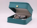 The Citizen watch displayed inside its original teal box with a small gold crown emblem.