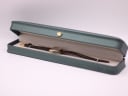 The Citizen watch presented in a green leatherette display box with a gold crown emblem.