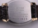 Macro close-up of the Citizen watch's stainless steel case back engraving, showing model number, serial, and 'GP'.