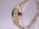 Right side profile view of the gold-tone Seiko watch, showing the octagonal case and fluted crown.