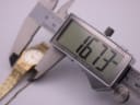 Digital caliper measuring the watch case, displaying a precise diameter of 16.73mm.