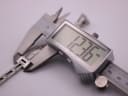 Digital caliper measuring the width of the Gucci 3900L watch case, showing 12.36mm.