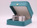 The D&G watch resting inside a generic green presentation box.