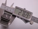 Digital caliper measuring the case width of the D&G watch, displaying 27.69mm.