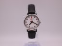 Front view of the Mondaine Official Swiss Railways Watch with a white dial, black hands, and red lollipop seconds hand on a black leather strap.