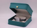 The Tissot PR 50 watch presented in a green leatherette display box.