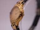 Close-up side view of the Tissot Stylist watch, highlighting the gold-tone case and crown detail.