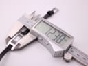 Digital caliper measuring the case width of the Gucci 3900L watch, showing 12.38mm.