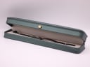 The Gucci 3900L watch displayed in a green presentation box.