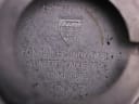 Close-up of the inner case back engraving, showing Tissot logo, "Fond Acier Inoxydable", "Lunette Plaque Or G 10 Microns" and serial number 15007.