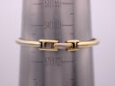 Rear view of the integrated gold-tone bracelet's butterfly clasp on a wrist sizing gauge, indicating a wrist circumference of approximately 160mm / 16cm.